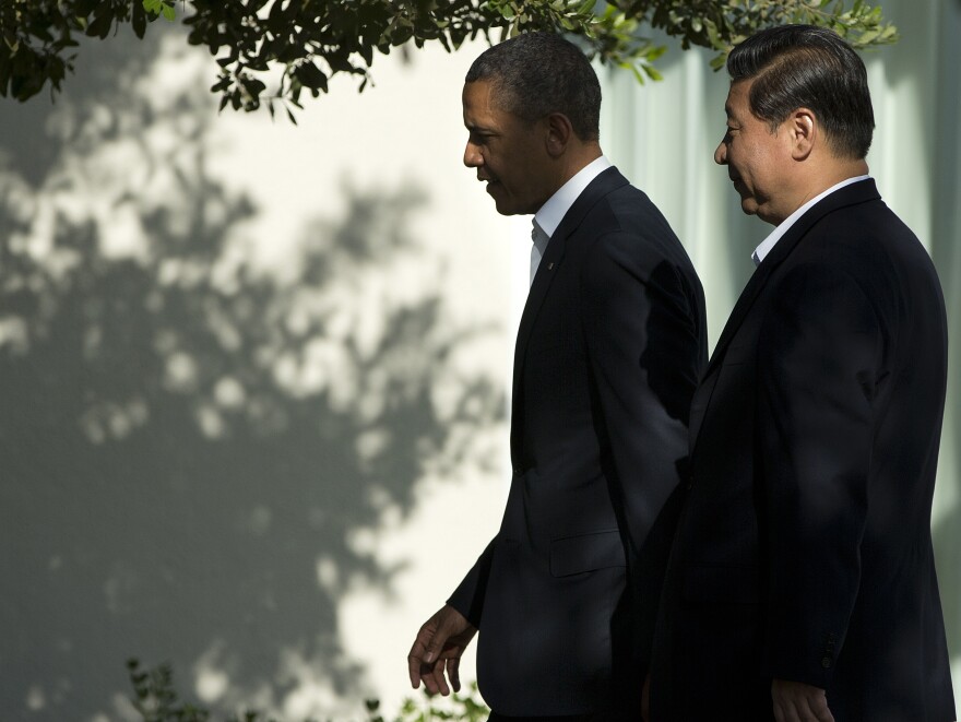 President Obama walks with Chinese President Xi Jinping at a retreat on Friday in Rancho Mirage, Calif., where the two leaders are meeting for talks.