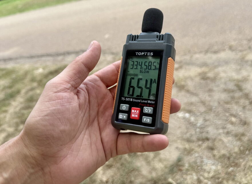 Jason Haley measures noise near xAI's gas turbines in Southaven, Mississippi, on Aug. 14, 2026.