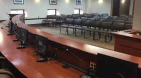 An image of room 414 in the Capitol Building in Pierre, South Dakota. The room is furnished but empty. 