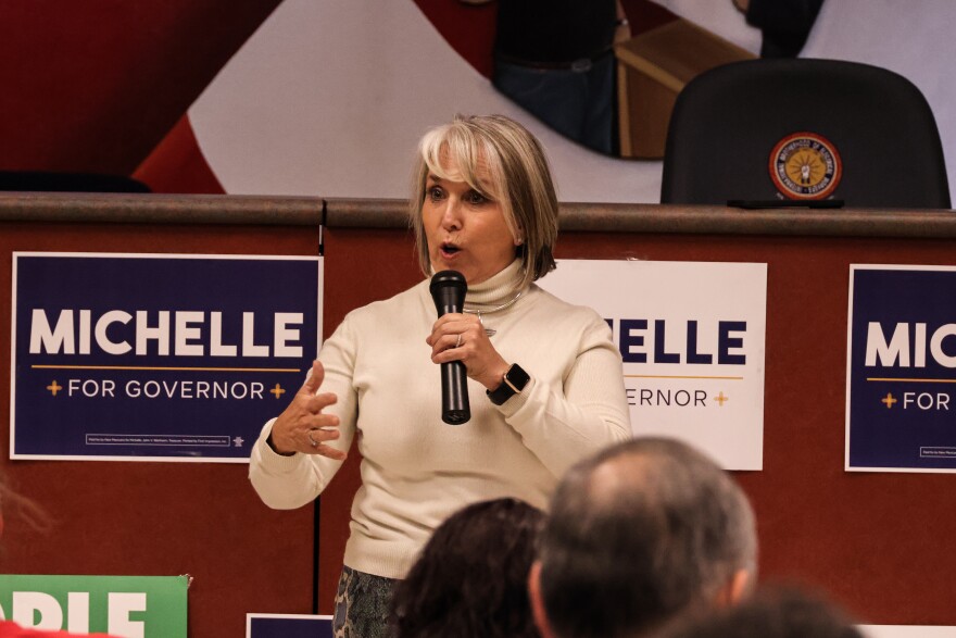 Gov. Michelle Lujan Grisham speaks to her supporters during Wednesday evening's rally