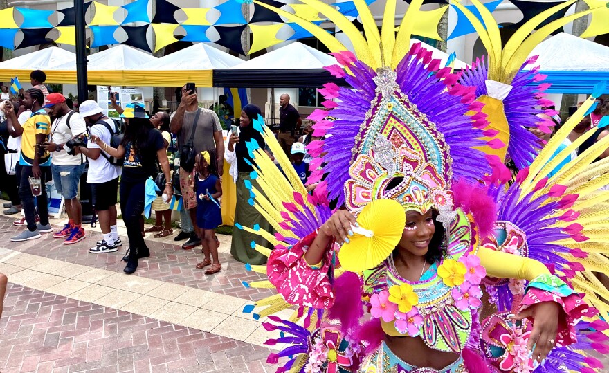 Junkanoo preformer dances in front of the street parade