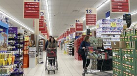People shop at a grocery store.