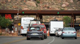 A line of vehicles wait to enter Zion National Park at the entrance outside of Springdale in southern Utah, June 9, 2025.