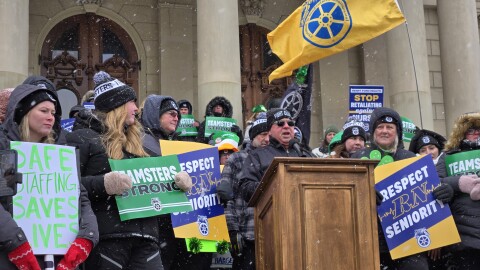 Kevin Moore, president of Teamsters Michigan, speaks on the steps of the Michigan Capitol on Tuesday, March 17, 2026.