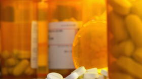 Prescription bottles full of opioid pills