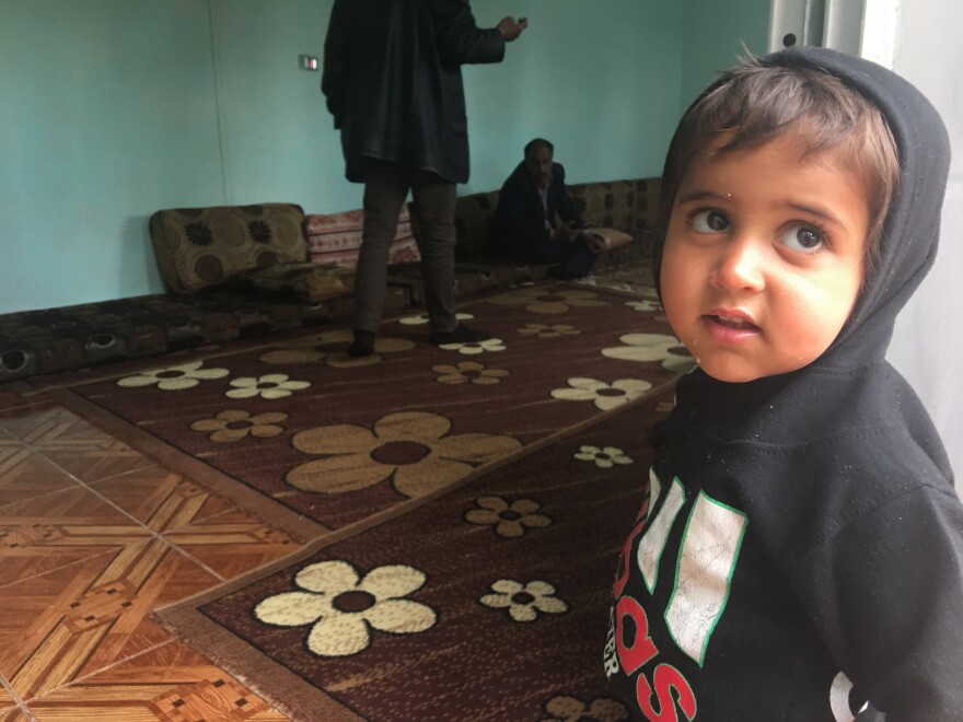 Ibrahim, 2, in northeastern Syria a few hours after his freed Yazidi mother returned to Iraq without him. Ibrahim's father was an ISIS fighter. Although his mother wanted to take him home, the Yazidis do not allow children of ISIS fathers to live with the community. Iraqi law considers the children Muslim rather than Yazidi.