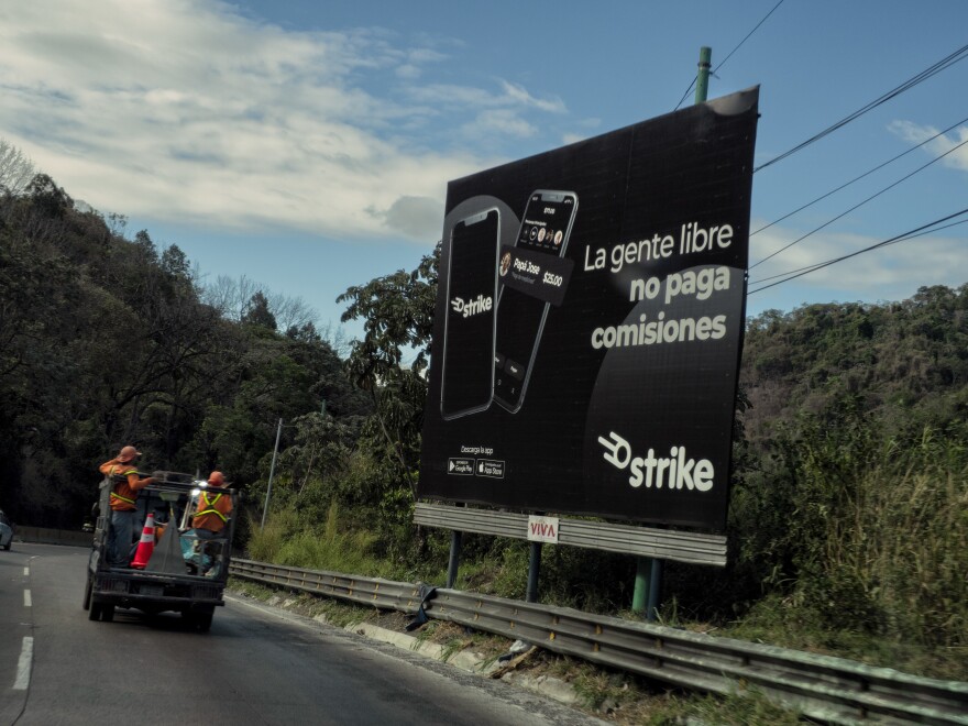 An advertisement for the digital wallet Strike, used in El Zonte, El Salvador, as a way to do bitcoin transactions. Through the app, users can buy and sell bitcoins or make and receive various kinds of payments.