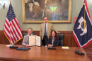 Gov. Mark Gordon (L), Todd Parfitt, director of WDEQ (M) and Andrea Kock (R), Director of Nuclear Material, Safety and Safeguards, pose for a picture after the signing.