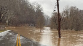 Flood waters impact a road in Knox County, Ky.