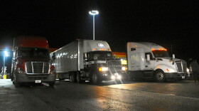 Trucks get fuel at a gas station in southern Indiana.