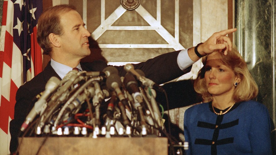 Joe Biden gestures during a news conference on Capitol Hill to announce his decision to withdraw as a candidate for the 1988 Democratic presidential nomination.