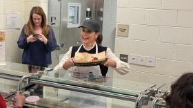 Governor Gretchen Whitmer works the lunch line serving students at Baker Middle School in Troy.