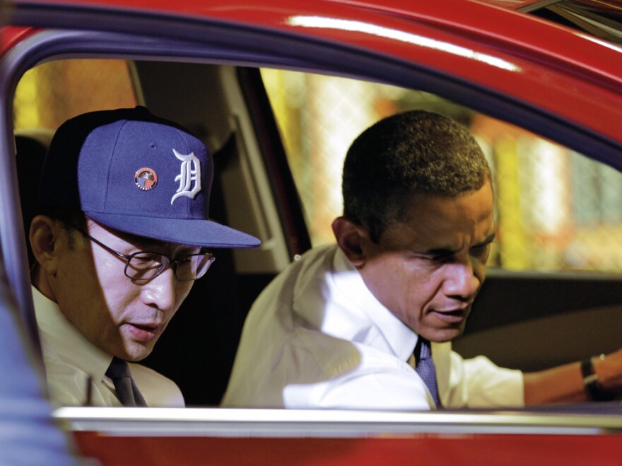 <p>President Obama and South Korean President Lee Myung-bak, wearing a Detroit Tigers baseball cap, check out the interior of the subcompact Chevrolet Sonic during their tour.</p>