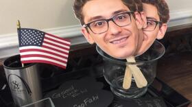 Signs with Fabiano Caruana's head are for the taking at the St. Louis Chess Club. The St. Louis resident is playing the reigning champion, Magnus Carlsen, for the World Chess Championship in London.