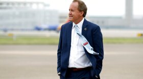 Texas State Attorney General Ken Paxton waits on the flight line for Vice President Mike Pence to arrive at Love Field in Dallas, Sunday, June 28, 2020. 
