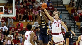 Trent Sisley jumping and stealing the ball mid-pass