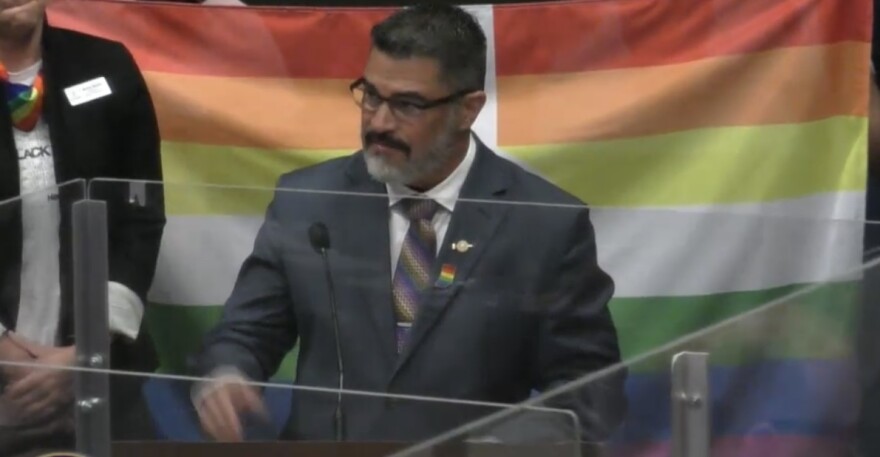 Indianapolis City-County Council Vice President Zach Adamson presents a special resolution.