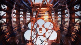 Sunlight daytime interior telescope rendering with people in the foreground.