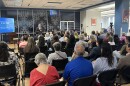 Dr. Abel Antonio Chávez, President of Our Lady of the Lake University, welcomes the group of residents, activists, and civil rights group members to the People's Hearing on Immigration Enforcement at the college's Sueltenfuss Library. 8/4/2026.