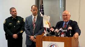 Lake County Supervisor of Elections Alan Hays speaks at a press conference in Tavares Wednesday, flanked by Sheriff's Office Capt. Todd English, left, and Lt. John Herrell. Photo: Joe Byrnes/WMFE