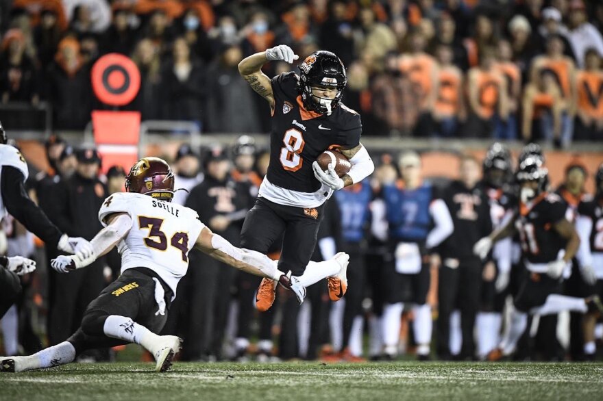 Oregon State's Trevon Bradford gets around an Arizona State defender in the Beavers' 24-10 win over the Sun Devlis on Nov. 20, 2021 in Corvallis, Ore.