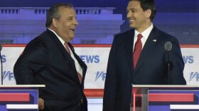 Former New Jersey Gov. Chris Christie talks with Florida Gov. Ron DeSantis during a break in the Republican presidential primary debate hosted by FOX News Channel Wednesday, Aug. 23, 2023, in Milwaukee. 