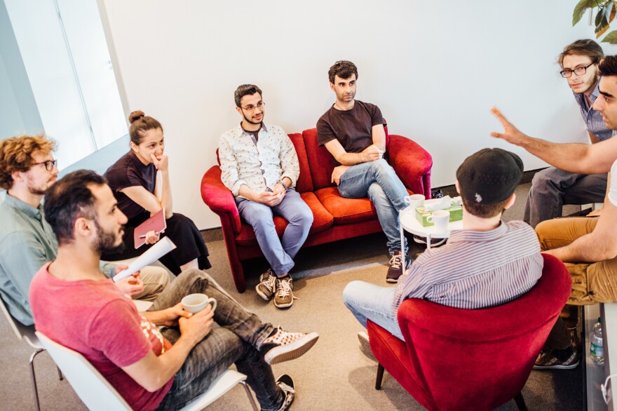 A group of peer counselors in training meets with Maryam Gardisi (third from left), program coordinator for the mental health group Ipso.