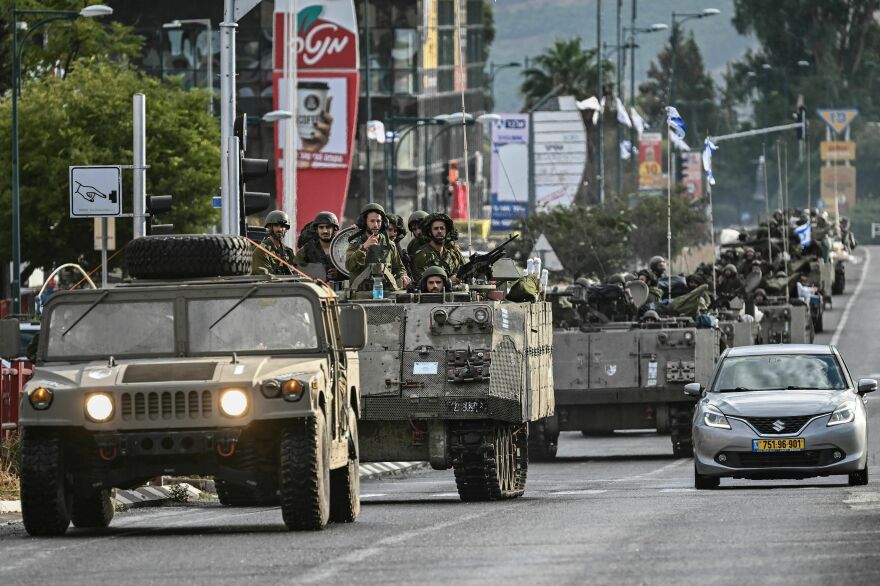 Sun., Oct. 15: Israeli soldiers patrol in armoured personnel carriers at an undisclosed position in northern Israel near the border with Lebanon.