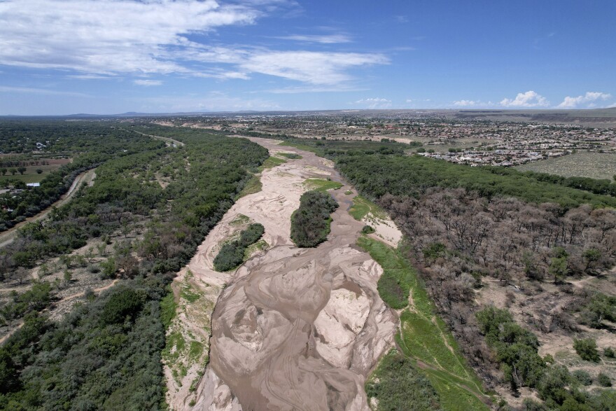 FILE - The dry Rio Grande riverbed is seen from the air, July 26, 2022, in Albuquerque, N.M.  (AP Photo/Brittany Peterson, File)