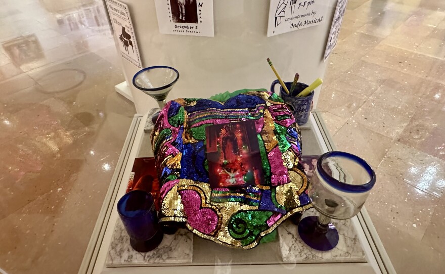 The "Atravez del tiempo/nochecita" mixed media display features a bustier often worn by Saluté owner, Azeneth Dominguez.