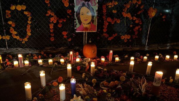Candles placed at a vigil for late activist Dolores Huerta