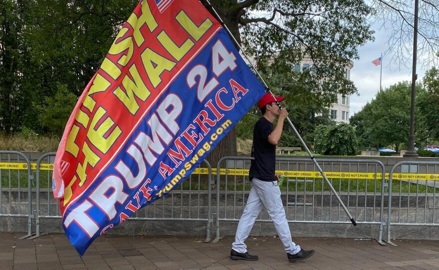 Protestor walking outside the Barrett Prettyman U.S. Courthouse in downtown Washington, D.C.