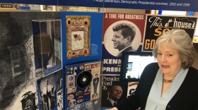 Ann Clements, education director for the Arkansas Humanities Council, shows part of an exhibit titled “Voices & Votes: Democracy in America" at the Arkansas State Capitol on Monday.