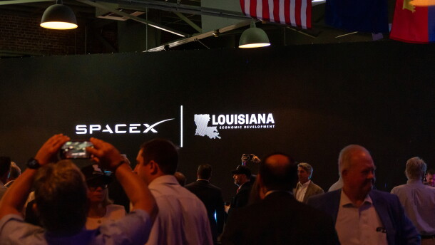 SpaceX and Louisiana Economic Development logos appear on a screen inside an event hall in downtown Abbeville, Louisiana, during the SpaceX announcement on Tuesday, August 25, 2026. 