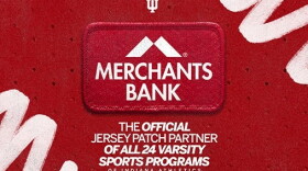 A red patch that says 'Merchants Bank'
