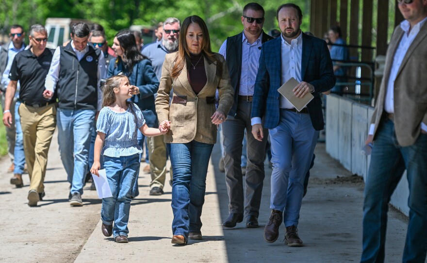 U.S. Secretary of Agriculture Brooke Rollins holds Tessa Nogan's hand after a farm roundtable at Tessa's family farm, Applewood Farm, in Scott Twp.