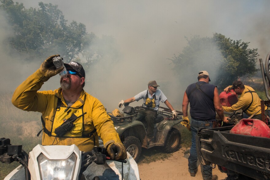 Members of a landowner-led prescribed burn association work together in south-central Nebraska to complete a 945-acre prescribed burn. Everyone on the burn performs an essential role, from the four-wheeler riding internal ignition team to the mop-up crew that patrols the perimeter with water tanks strapped to flatbed pickup trucks.