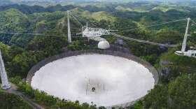 Operations at the UCF-managed Arecibo Observatory (pictured here in the spring of 2019) are stopped until repairs can be made from an incident in August that caused a 100-foot-long gash on the telescope’s reflector dish. Photo: UCF