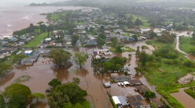 Streets are flooded from severe rains, Friday, March 20, 2026, in Haleʻiwa, Hawaiʻi.