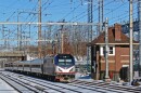 An electrically powered Amtrak train approaches the Princeton Junction, N.J. station, along the Northeast Corridor, in February 2026. Amtrak officials have said dual-mode engines, which can use diesel or electric power, would be used on the planned route between Scranton and New York City.