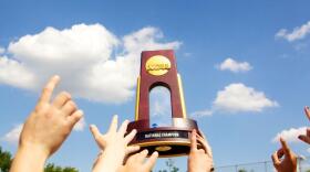 Nation Champion hold their trophy high