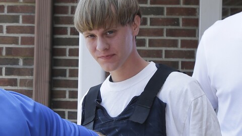 Dylann Roof is escorted from the Shelby Police Department in Shelby, N.C., on June 18, 2015.