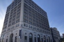 The 11-story PNC Bank Building in downtown Peoria towers in the foreground over the smaller Creve Couer Building in the background. 