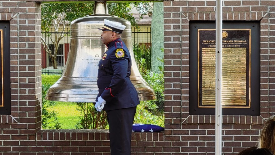 Fire department honor guard Commander Justin Adler rang the firefighter memorial's brass bell as the names of each of the 25 men who died in the line of duty in Jacksonville were read off.