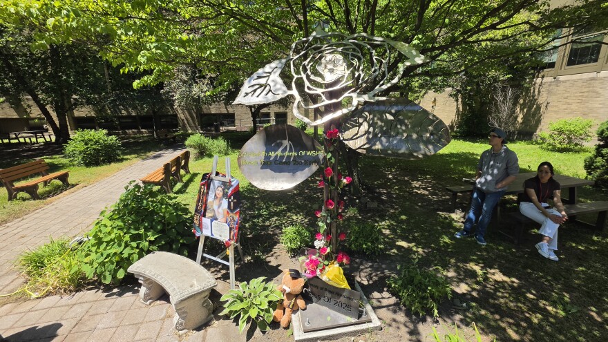 Family placed roses on the stem of the statue, which serves as a memorial to Rose Hernandez and other West Scranton High School students gone too soon.