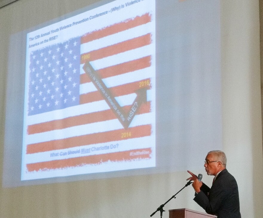 Dr. David Jacobs, a violence prevention specialist at Carolinas HealthCare System, offered crime data at the start of Friday's conference, at Friendship Missionary Baptist Church on Beatties Ford Road. 