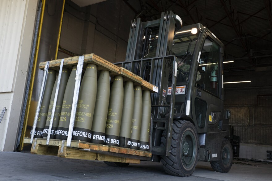 FILE - Airmen with the 436th Aerial Port Squadron use a forklift to move 155 mm shells ultimately bound for Ukraine, April 29, 2022, at Dover Air Force Base, Del. When U.S. lawmakers approved a spending bill Saturday, Sept. 30, that averted a widely expected government shutdown, the measure didn’t include the $6 billion in military assistance that Ukraine said it urgently needed. Now the Pentagon, White House and European allies are urging Congress to quickly reconsider. (AP Photo/Alex Brandon, File)