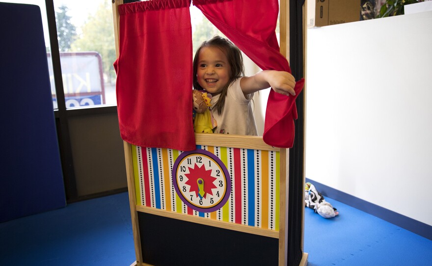 Isley Best, 4, puts on a puppet show on Sunday, October 1, 2017, at We Rock the Spectrum Kid's Gym in Bellevue. 