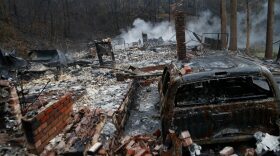 The remains of a home smolder in the wake of a wildfire Nov. 30, 2016 in Gatlinburg, Tennessee. (Brian Blanco/Getty Images)