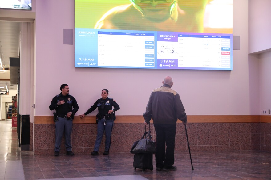 A passenger checks arrival and departure times at the El Paso International Airport amid a temporary flight restriction for the area's airspace.